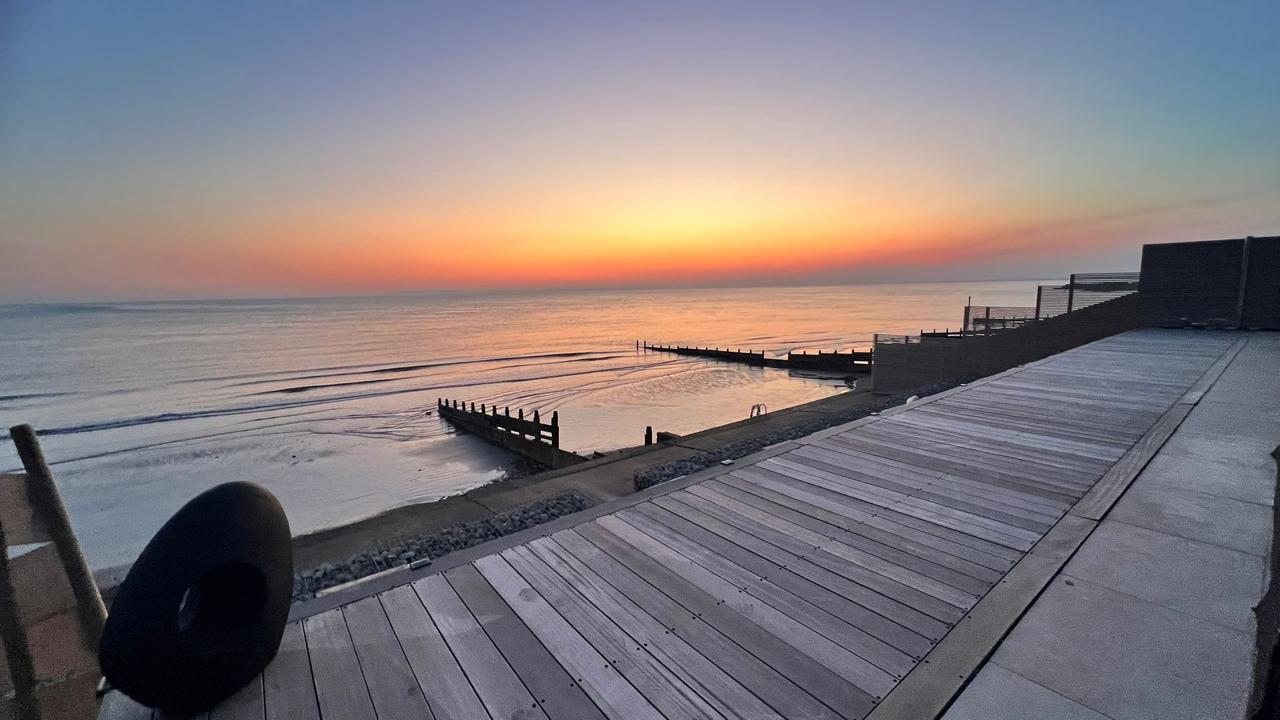 Luxury decking by the sea at sunset